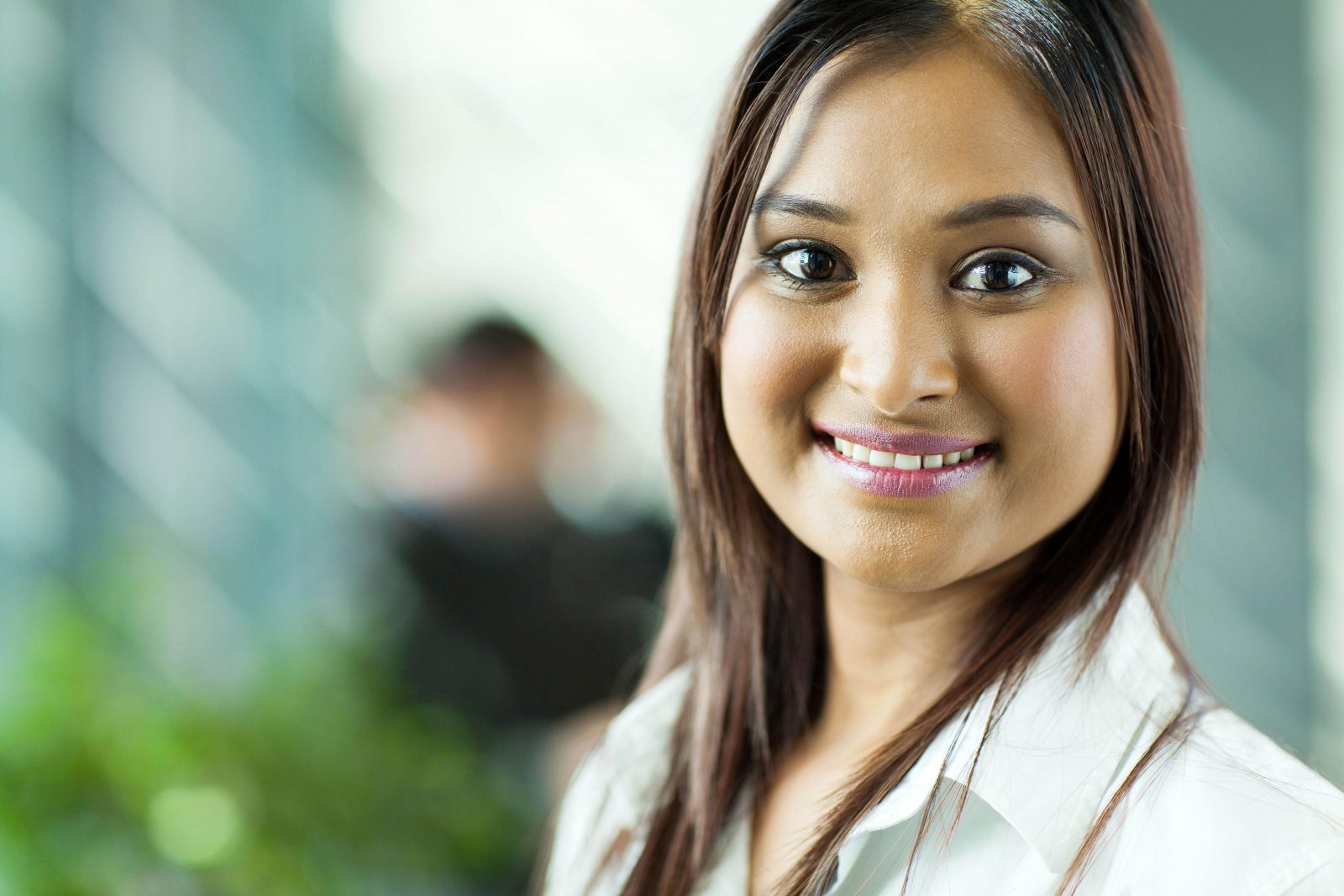 beautiful indian businesswoman close up portrait in office