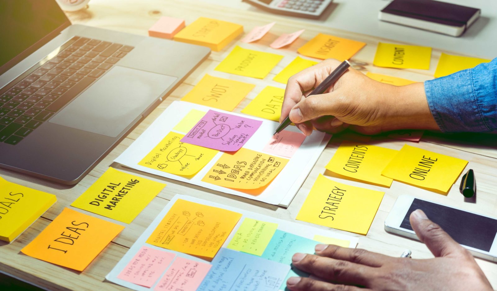 businessman working with notepaper of strategy ideas.
