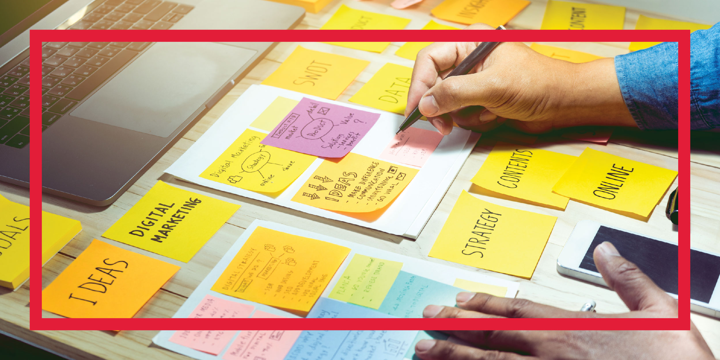 Writing creative ideas on sticky notes